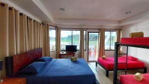 Postel nebo postele na pokoji v ubytování Tortuguero Adventures GuestHouse