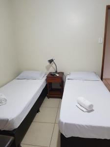 Postel nebo postele na pokoji v ubytování Geko Pousada Paraty