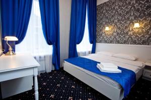 Postel nebo postele na pokoji v ubytování Hotel Litera
