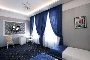 Postel nebo postele na pokoji v ubytování Hotel Litera