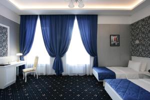 Postel nebo postele na pokoji v ubytování Hotel Litera