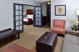 a hotel room with a bed and a living room at Comfort Suites Airport Tukwila Seattle in Tukwila +37 photos
