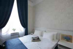 Postel nebo postele na pokoji v ubytování Hotel Litera