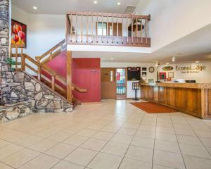 a lobby of a fast food restaurant with a staircase at Econo Lodge Inn & Suites in Stevens Point
