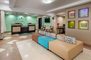 a waiting room with couches and a bar in a hospital at Quality Inn in Covington