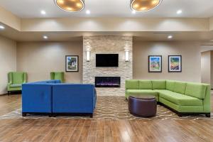 a lobby with a couch and a fireplace at Comfort Suites San Antonio Ft Sam Houston-SAMMC Area in San Antonio