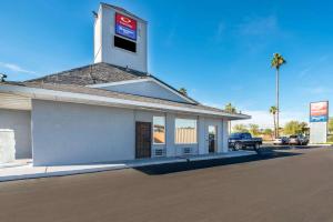 a gas station with a sign on top of it at Rodeway Inn Phoenix North I-17 in Phoenix