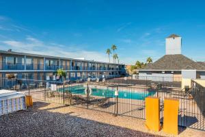a resort with a pool and a building at Rodeway Inn Phoenix North I-17 in Phoenix