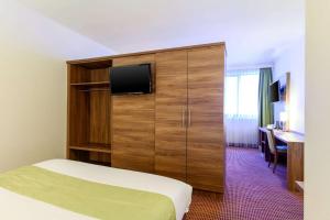 TV a/nebo společenská místnost v ubytování Hotel Opera Antwerpen Centrum + 11 fotografií