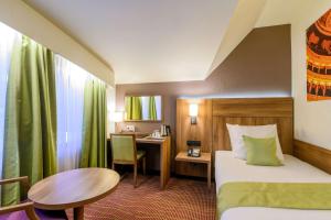 Postel nebo postele na pokoji v ubytování Hotel Opera Antwerpen Centrum