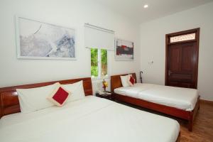 Krevet ili kreveti u jedinici u objektu Eco Resort Phu Quoc