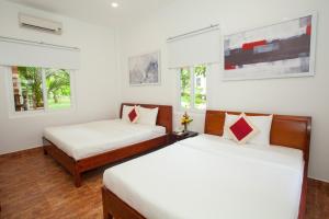 Кровать или кровати в номере Eco Resort Phu Quoc