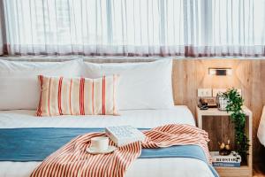 Cama ou camas em um quarto em So Boutique Pattaya Hotel & Residence