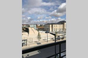 a view of a parking lot from a window at le Nicole in Chartres