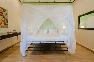Un ou plusieurs lits dans un hébergement de l'établissement Mediterraneo Boutique Hotel
