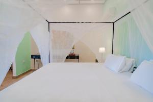 Un ou plusieurs lits dans un hébergement de l'établissement Mediterraneo Boutique Hotel