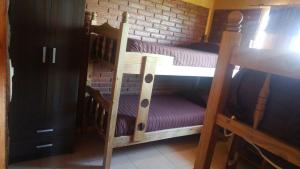 a couple of bunk beds in a room at Cabañas El descanso in San Rafael +10 photos