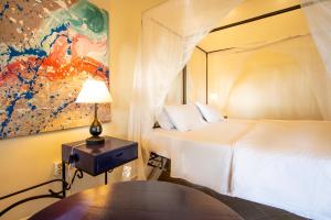 Un ou plusieurs lits dans un hébergement de l'établissement Mediterraneo Boutique Hotel