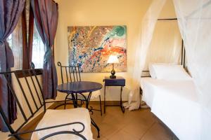 Un ou plusieurs lits dans un hébergement de l'établissement Mediterraneo Boutique Hotel