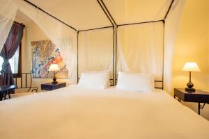 Un ou plusieurs lits dans un hébergement de l'établissement Mediterraneo Boutique Hotel