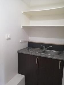 a kitchen with a sink and a counter top at 36 Mount Road Guesthouse and Self Catering in Port Elizabeth