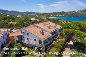 an aerial view of a house on a hill with the ocean at Baia Del Faro in Palau