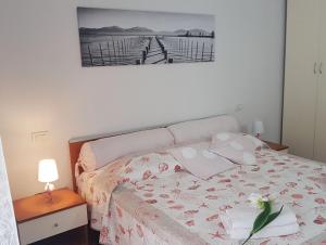 Postel nebo postele na pokoji v ubytování In Vacanza da Miki 03