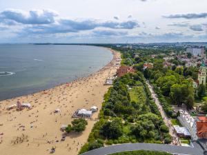 an aerial view of a beach with people on it at Villa Sedan - Destigo Hotels in Sopot