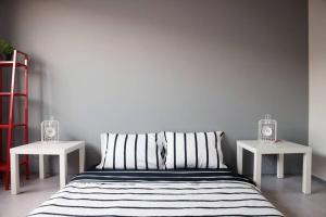Кровать или кровати в номере Minima Residence
