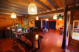 a dining room with a table and chairs in it at La Beauté Bắc Hà in Bắc Hà