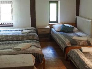 Cama ou camas em um quarto em Zacisze Trzech Gór