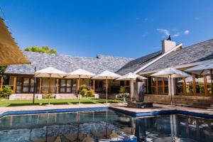 an exterior view of a house with a swimming pool at Villiera Guesthouse in Douglas