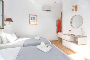 Postel nebo postele na pokoji v ubytování Kosyforema Villas