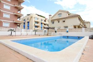 Bazén v ubytovaní Global Properties, Estudio para parejas con piscina en Canet playa alebo v jeho blízkosti