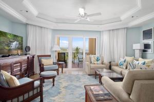 a living room with a couch and a table at Great Bay Condominiums located at The Ritz-Carlton Club, St Thomas in St Thomas