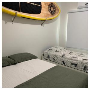 מיטה או מיטות בחדר ב-BORBOLETAS DO MAR