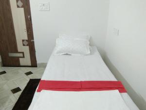 Postel nebo postele na pokoji v ubytování Sukun Guest House