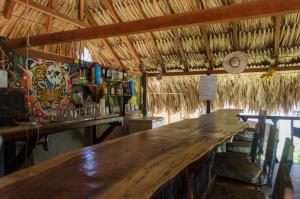 a bar in a restaurant with a large wooden counter at Kaluta in Palomino