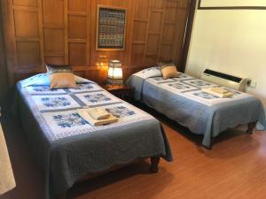 Postel nebo postele na pokoji v ubytování Hotel Siblanburi Resort