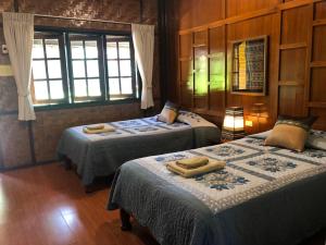 Postel nebo postele na pokoji v ubytování Hotel Siblanburi Resort