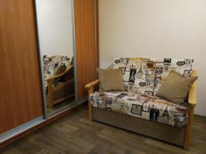 a room with a bed and a mirror at 1к квартира у метро Салтовская , бывшая Героев Труда in Kharkiv