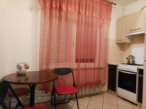 a kitchen with a table and chairs and a window at 1к квартира у метро Салтовская , бывшая Героев Труда in Kharkiv