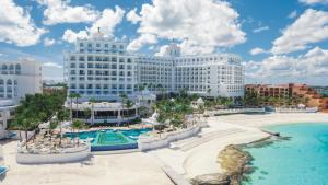 an aerial view of a resort with a pool at Riu Palace Las Americas - All Inclusive - Adults Only in Cancún