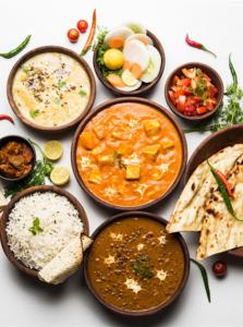 a group of bowls of different types of food at Hotel Paradise inn in Udaipur