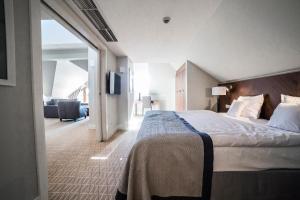 Säng eller sängar i ett rum på Natura Mazur Resort & Conference