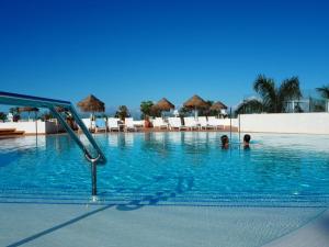 two people in the swimming pool at a resort at Flamingo Beach Mate in Adeje