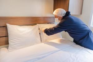 Cama ou camas em um quarto em Hotel Residencial Alfa