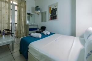Postel nebo postele na pokoji v ubytování ROY Hotel