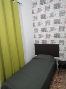 A bed or beds in a room at Alcaravaneras Hostel