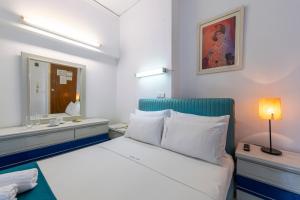 Postel nebo postele na pokoji v ubytování ROY Hotel